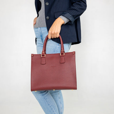 Small Lady in burgundy leather