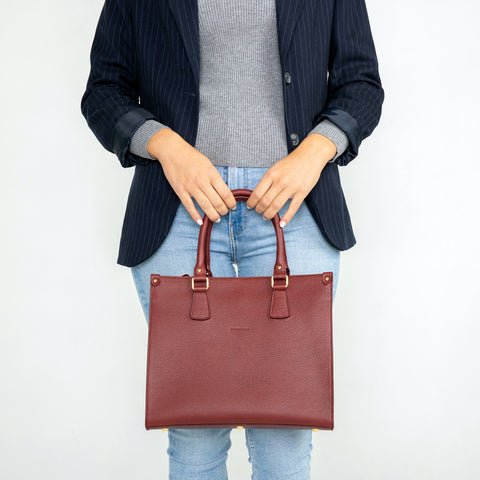 Small Lady in burgundy leather