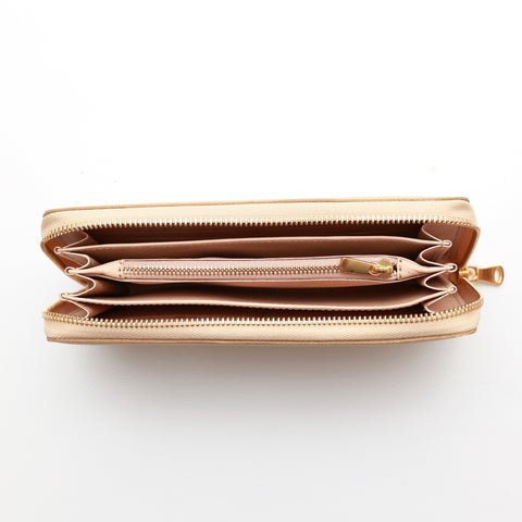 Portafoglio da donna in pelle martellata caramello, chiusura laterale con zip, interno in cuoio naturale, prodotto da Pianigiani.